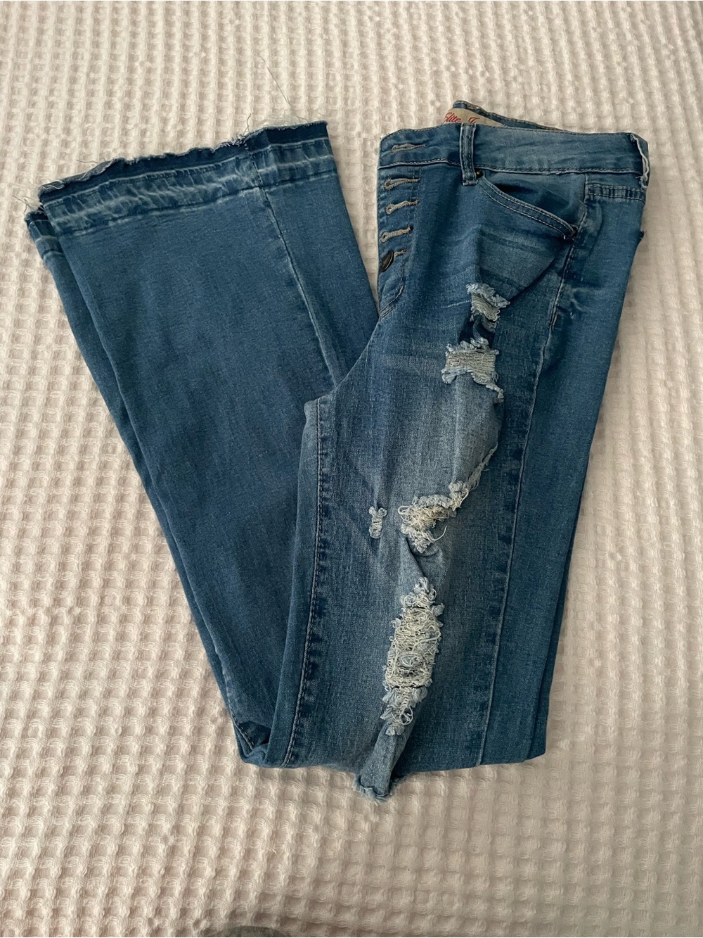 High-Rise Distressed Flare Jeans in Dark Blue size 9/29